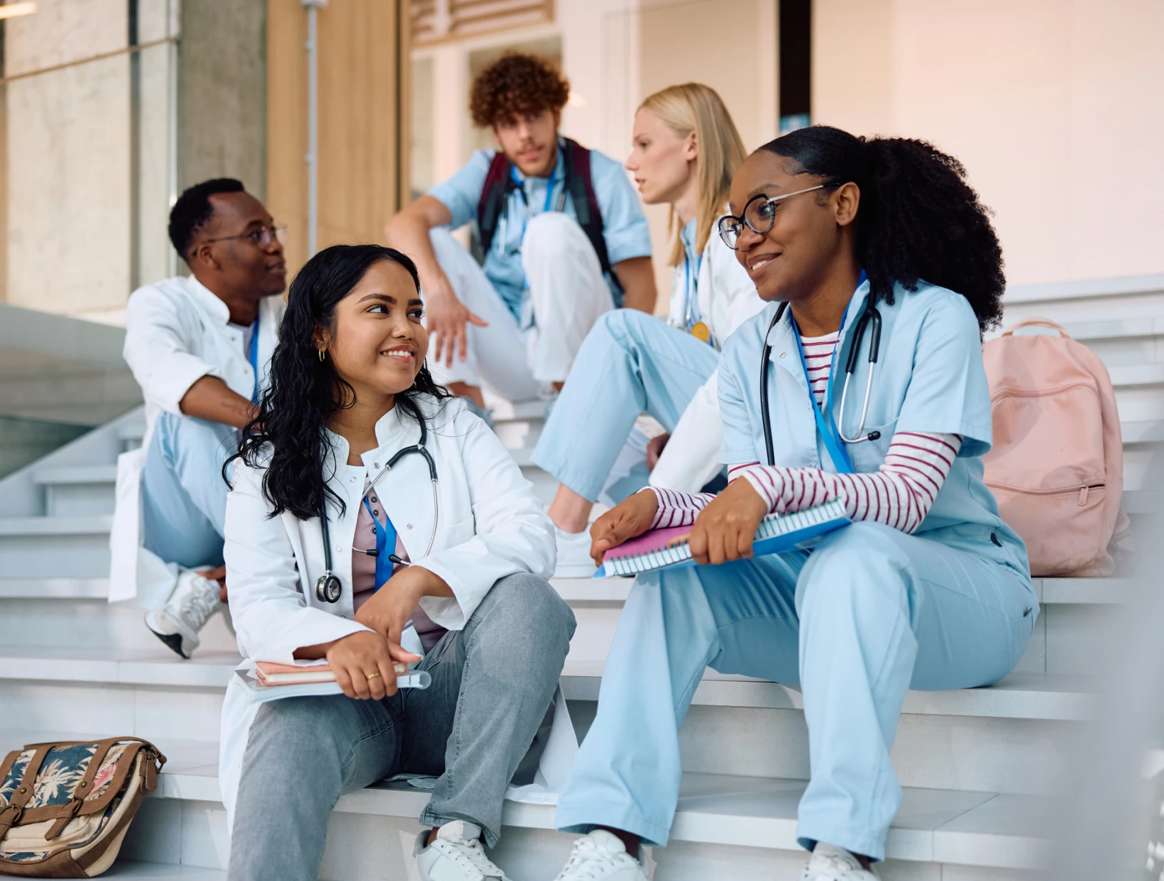 Medical students chatting on staircase